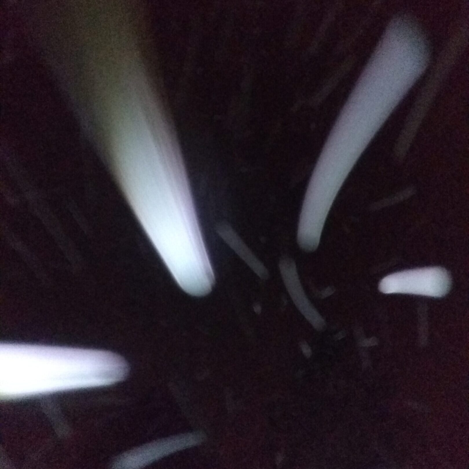Abstract light streaks on dark background.