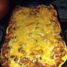 Baked lasagna with melted cheese topping.