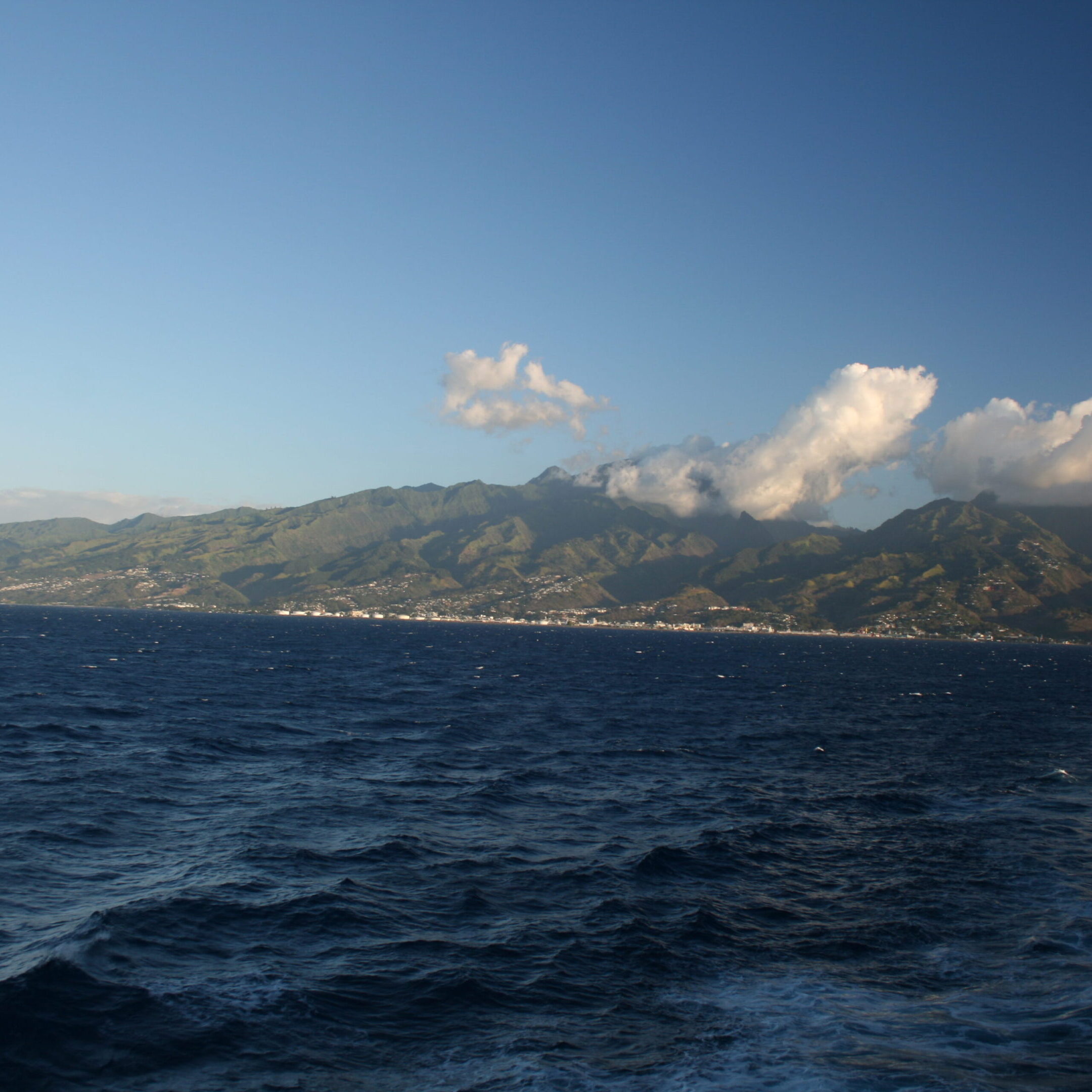 Ocean view with distant mountainous coastline.