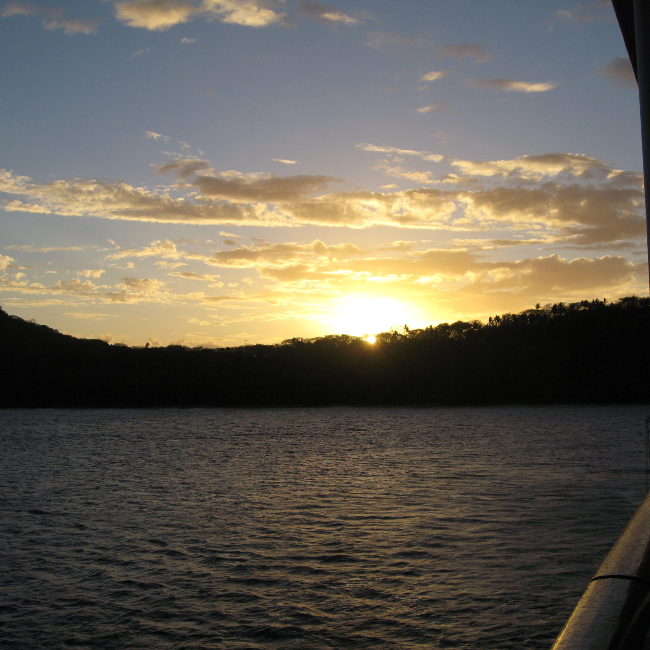 Sunset over a calm ocean view.