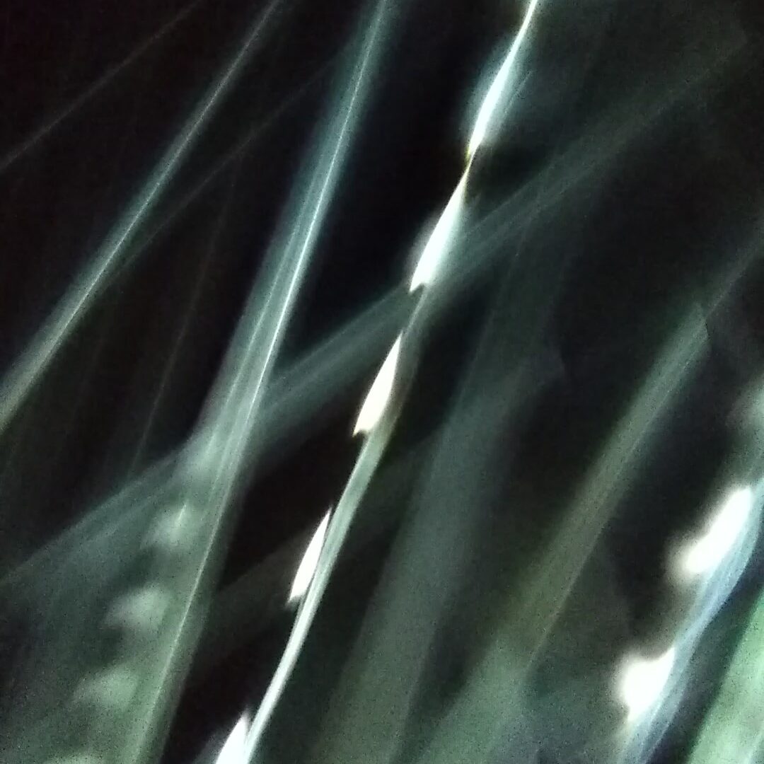 Abstract light streaks on dark background.